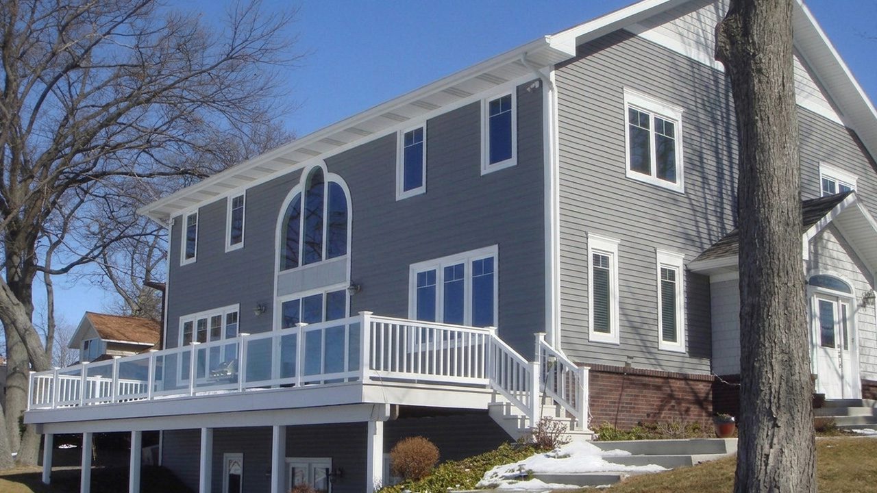 Modern gray house with large balcony.