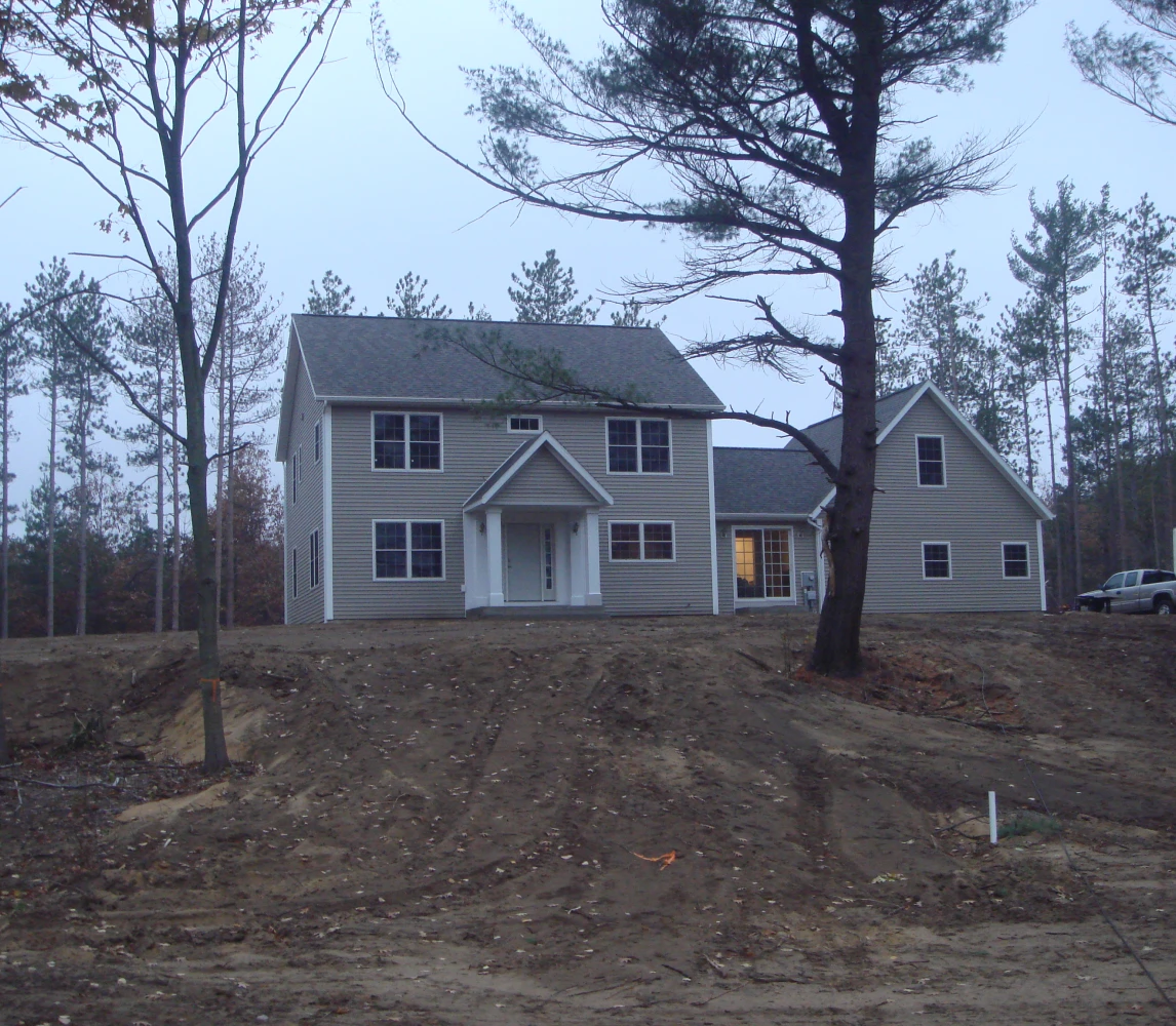 Two-story house surrounded by trees