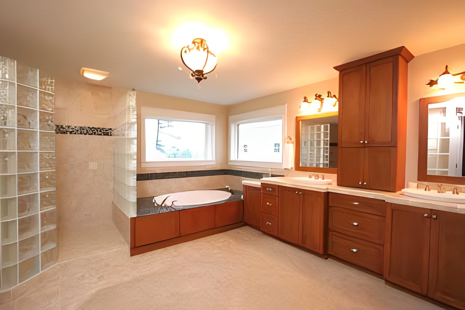 Spacious bathroom with bathtub and wooden cabinets.