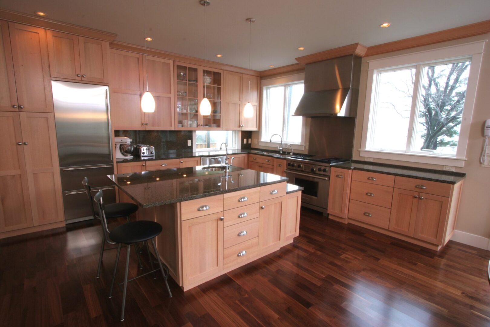 Modern kitchen with wooden cabinets and island.