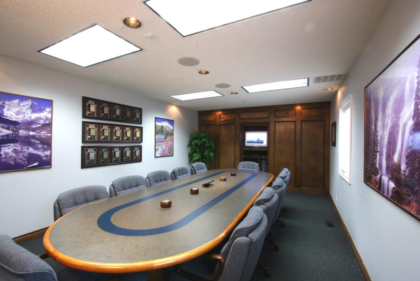Conference room with long oval table.